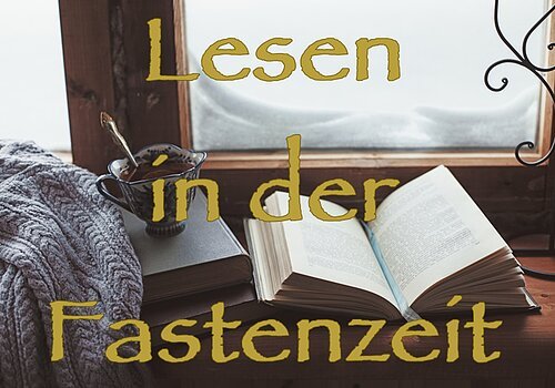 Warm and comfy winter concept. Book, cup of lemon tea and sweater on wooden window sill in old house. Reading and relaxing in cold snowy weather at home. Quiet silent homely scene.